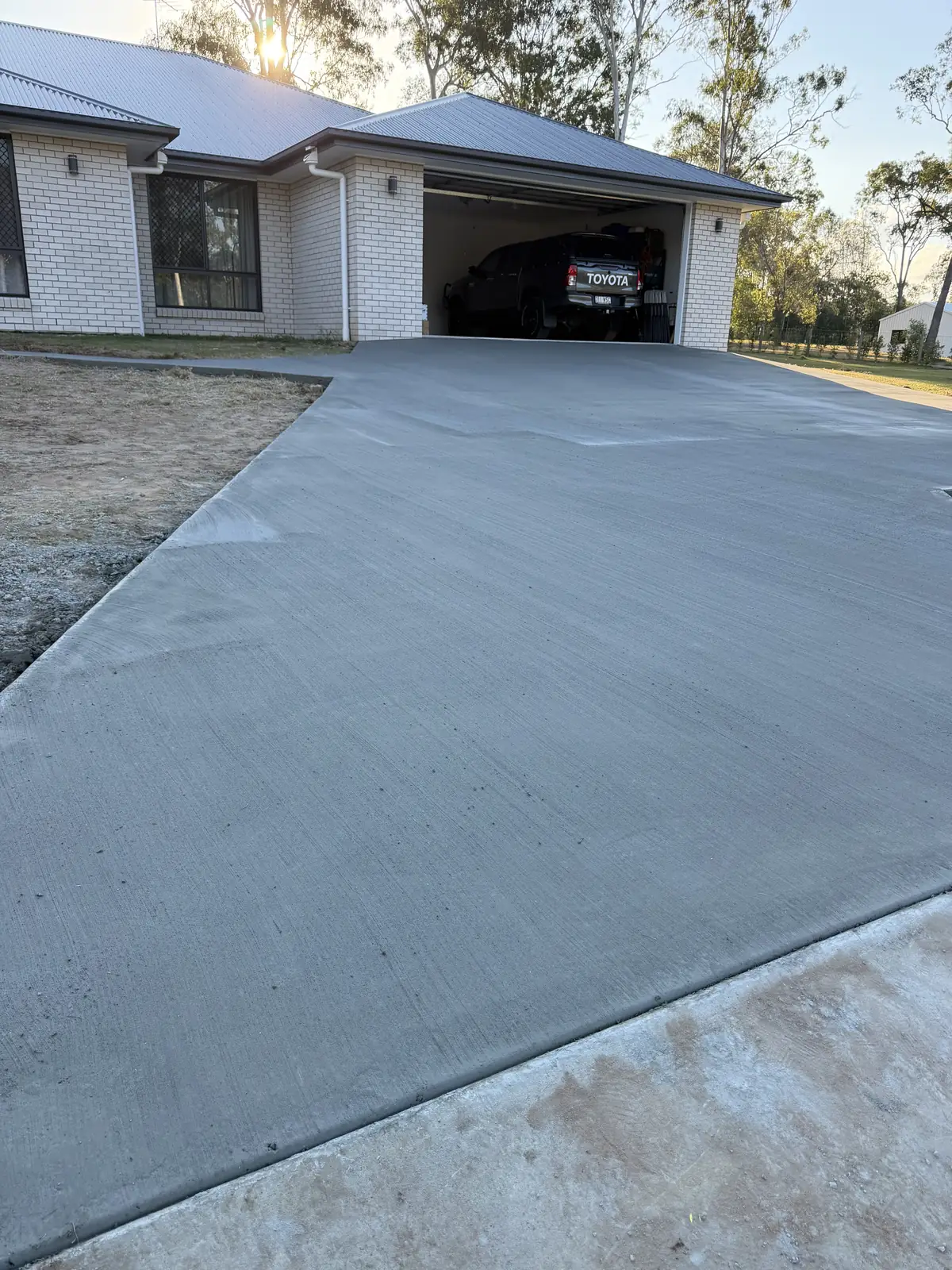 New concrete driveway and path to the front of a house