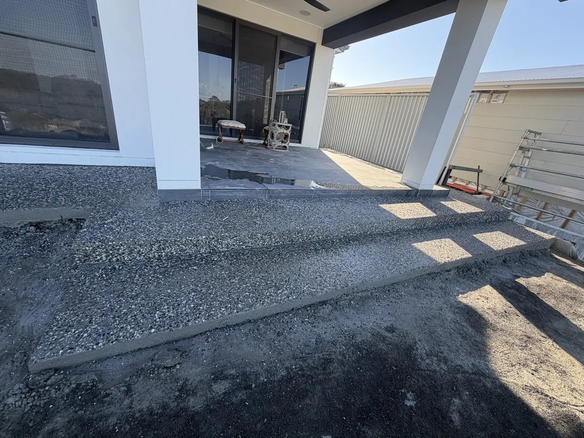 Exposed aggregate slab under an alfresco