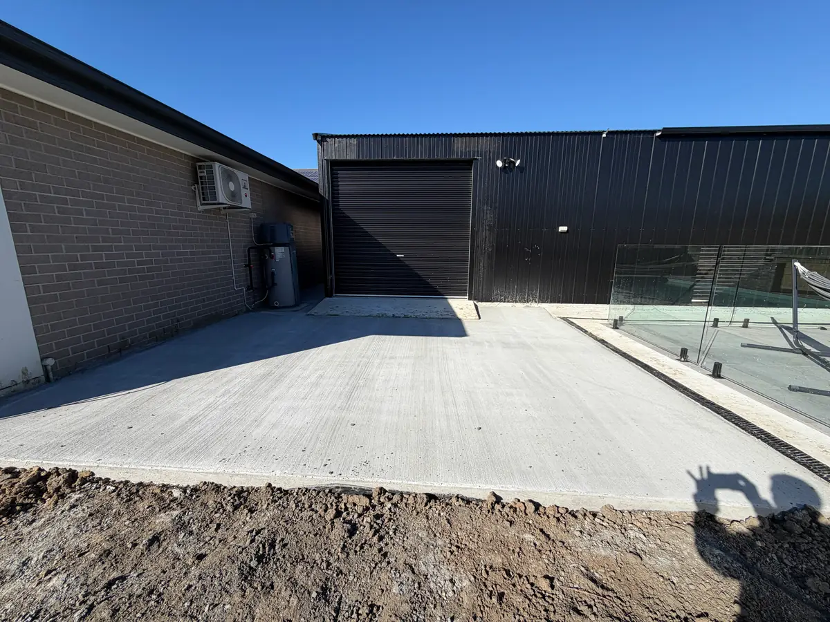 Shed slab poured beside a house with the shed already standing